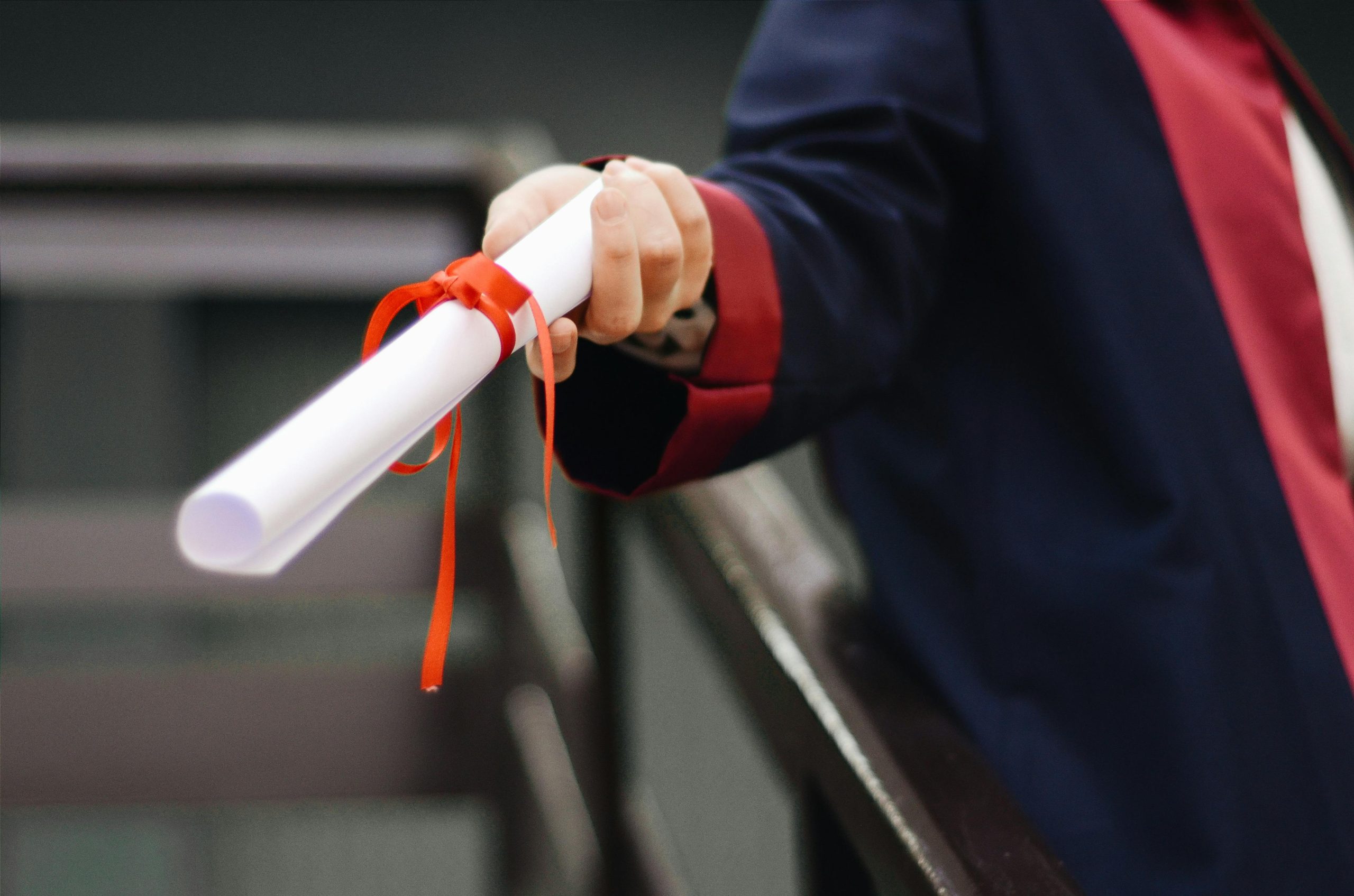 Person holding white scroll